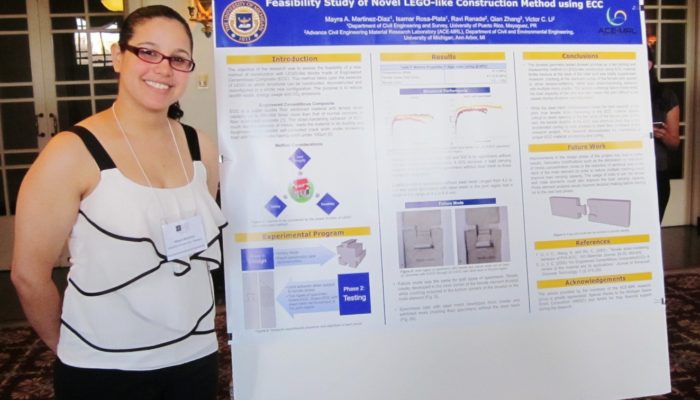 A woman standing in front of a posterboard